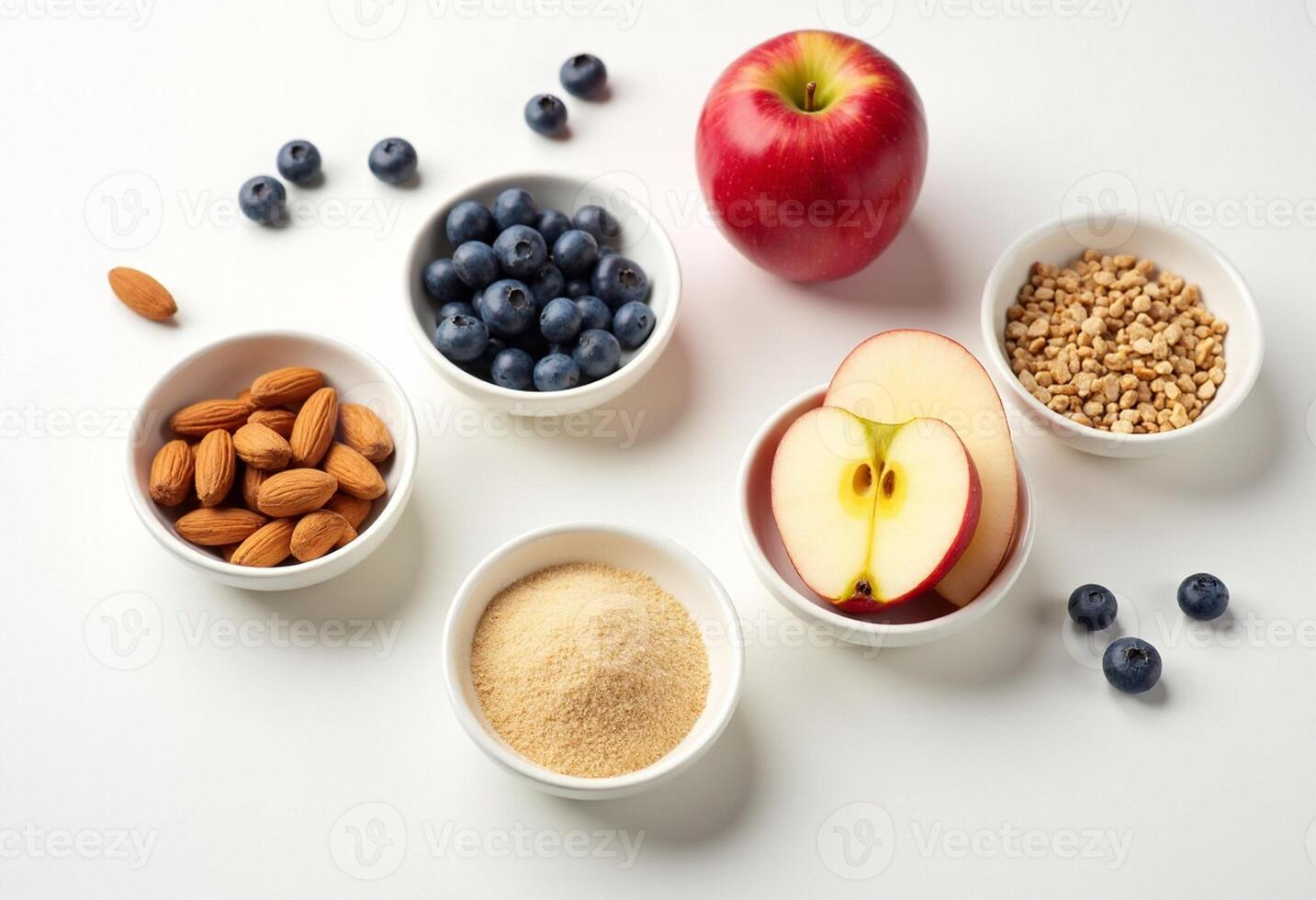 A variety of foods including apples, blueberries, almonds, and oats photo