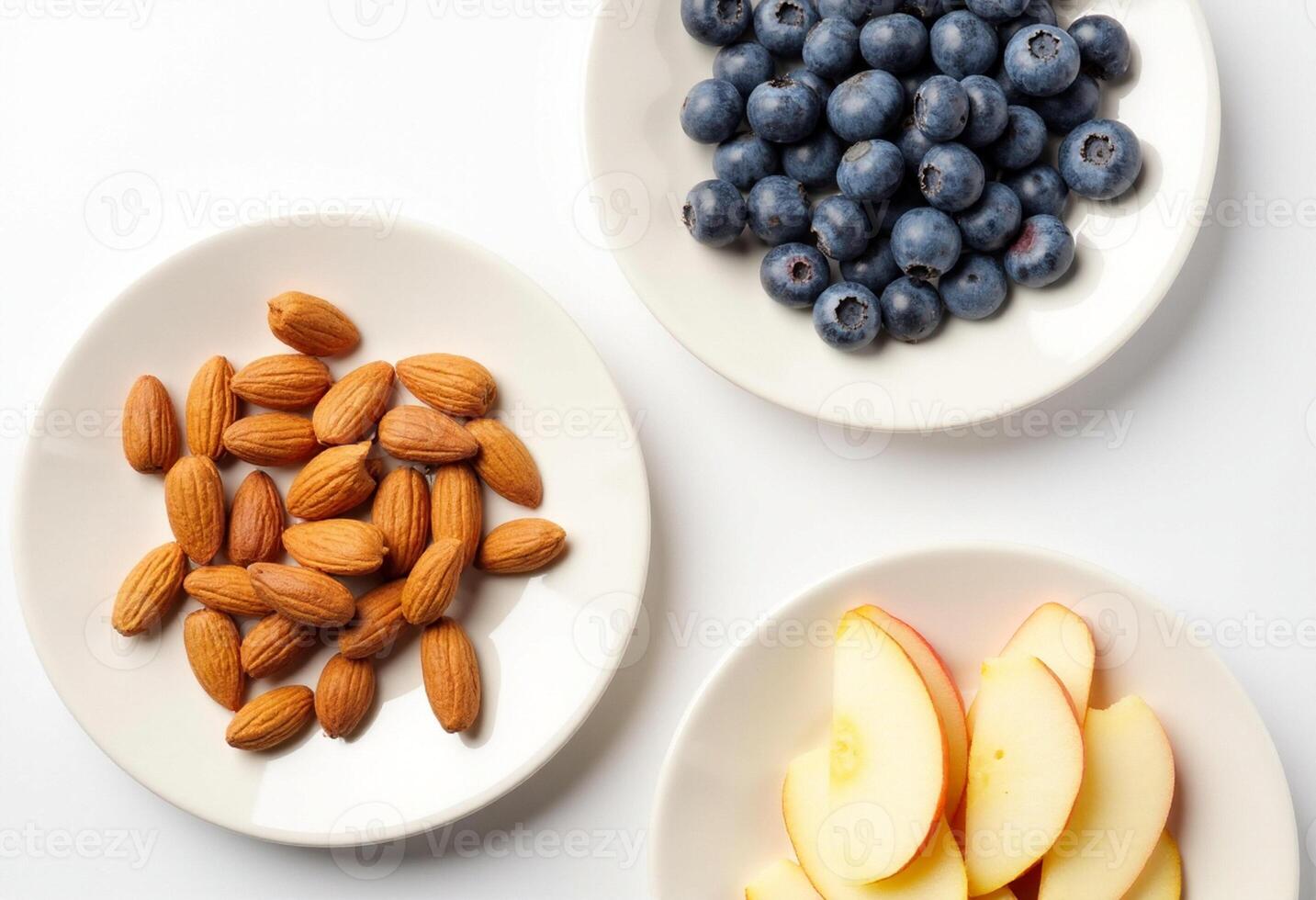 Three plates with blueberries, almonds and blueberries photo