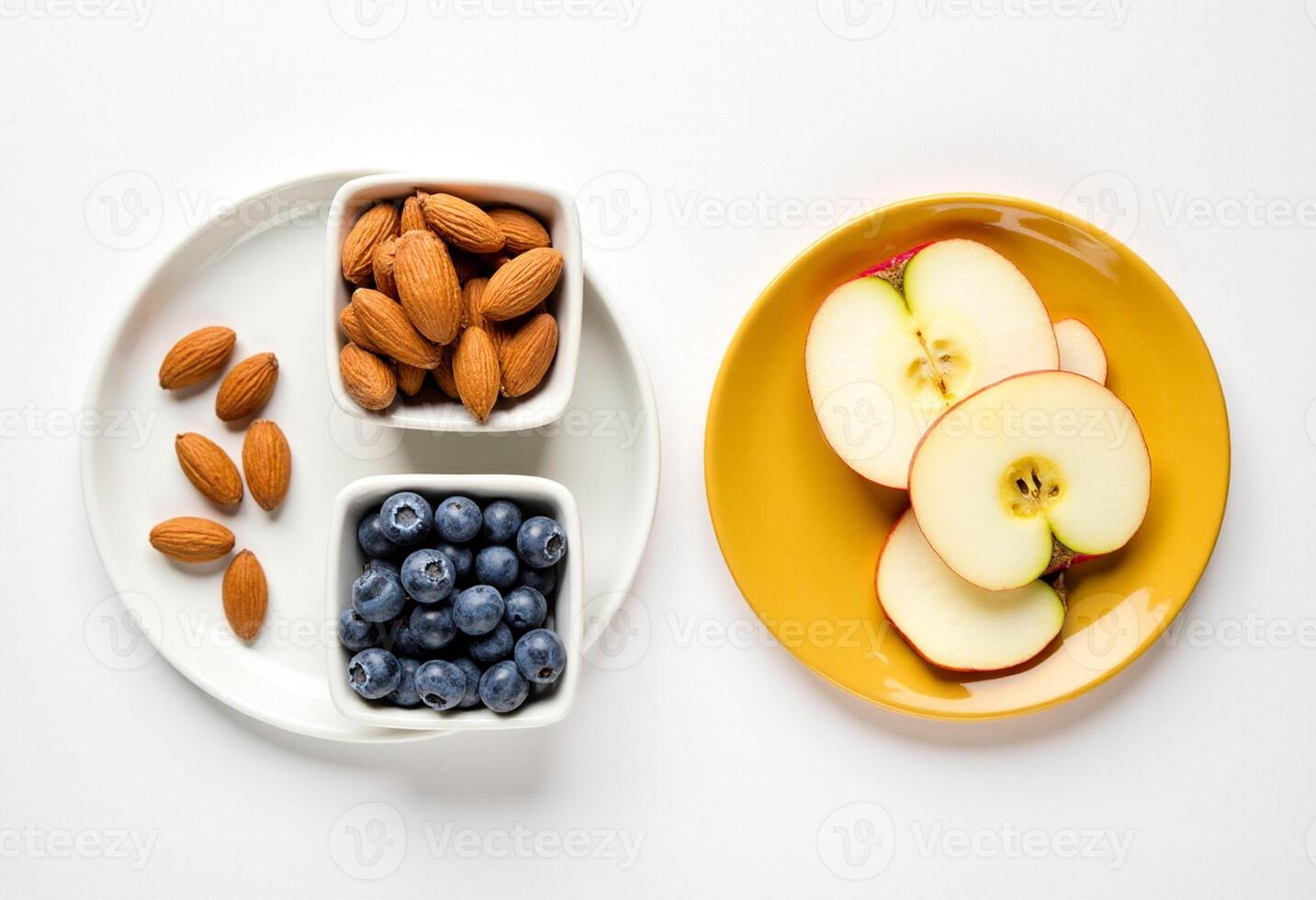 A plate with apples, blueberries and almonds photo