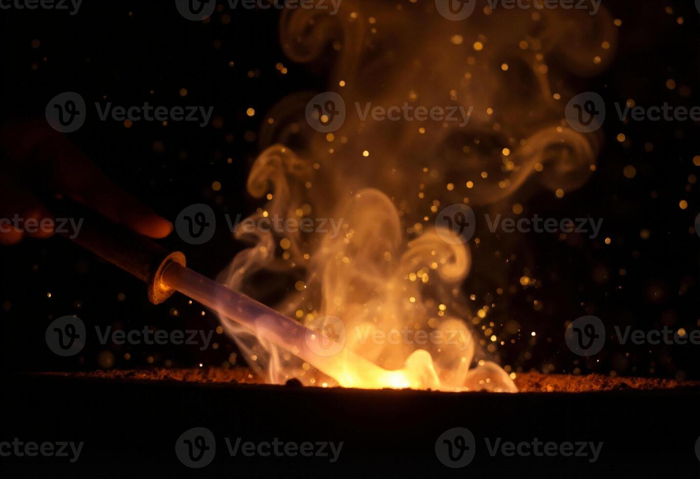 A person holding a torch with fire coming out of it photo