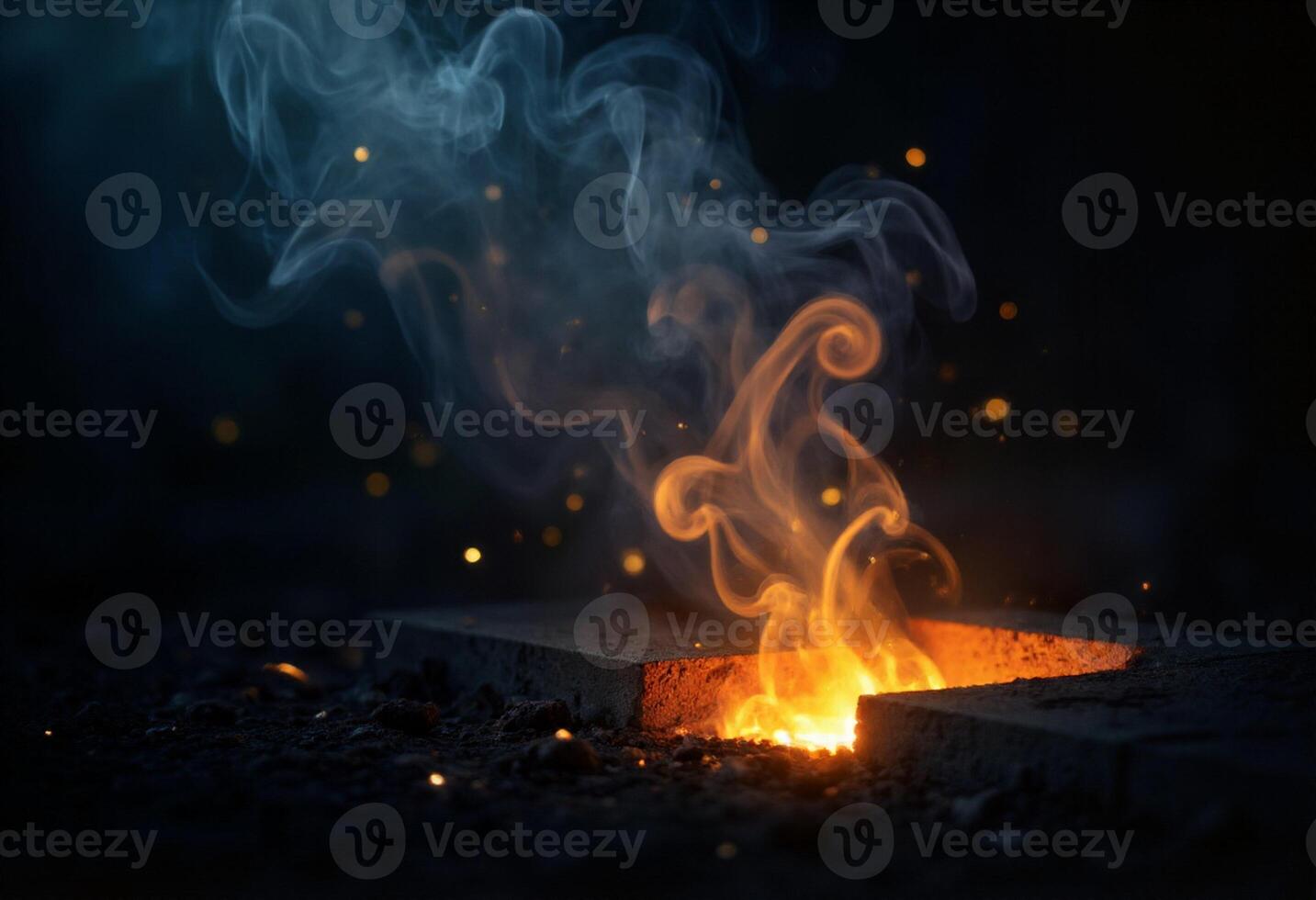 A fire is burning in a brick with smoke coming out photo
