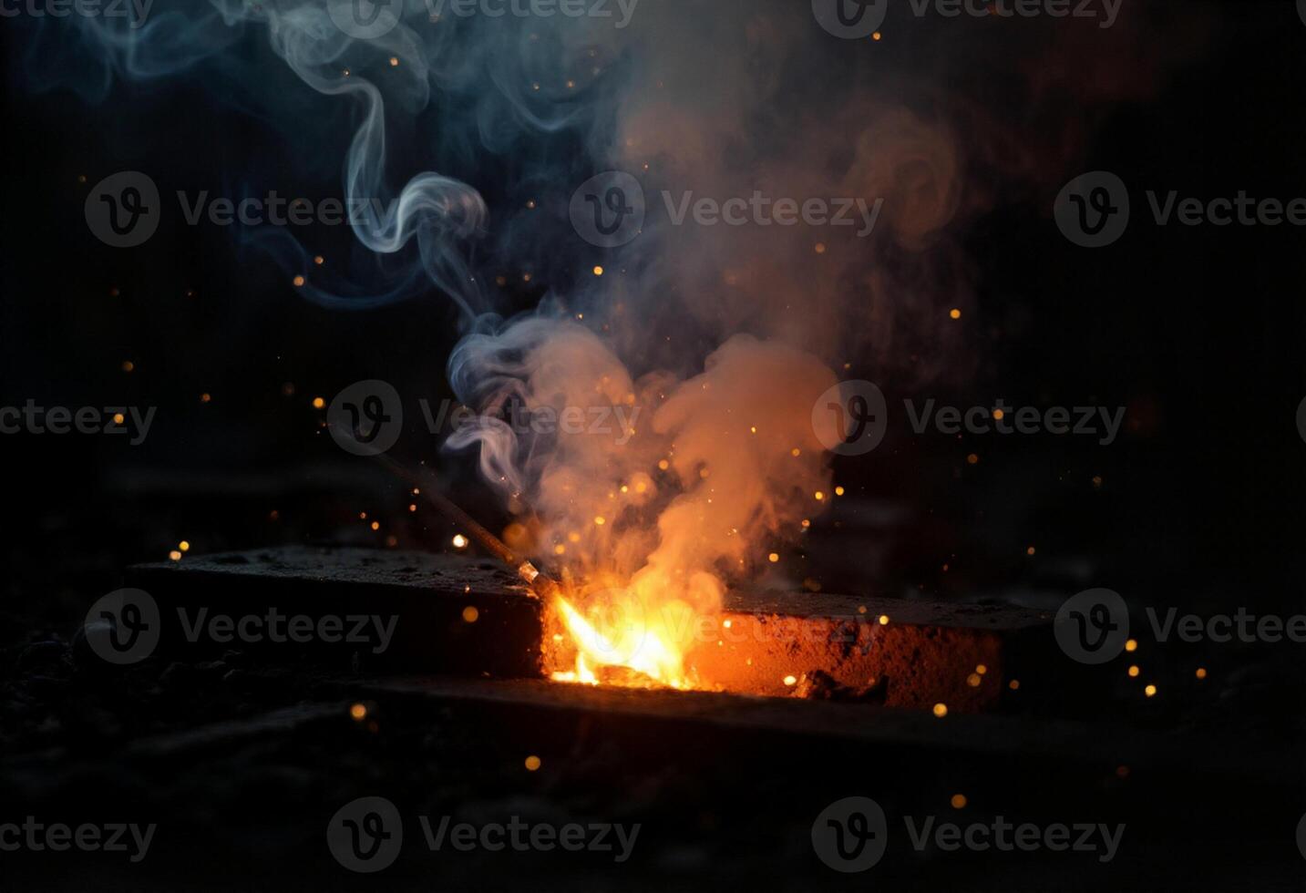 A close up of a piece of metal being melted photo
