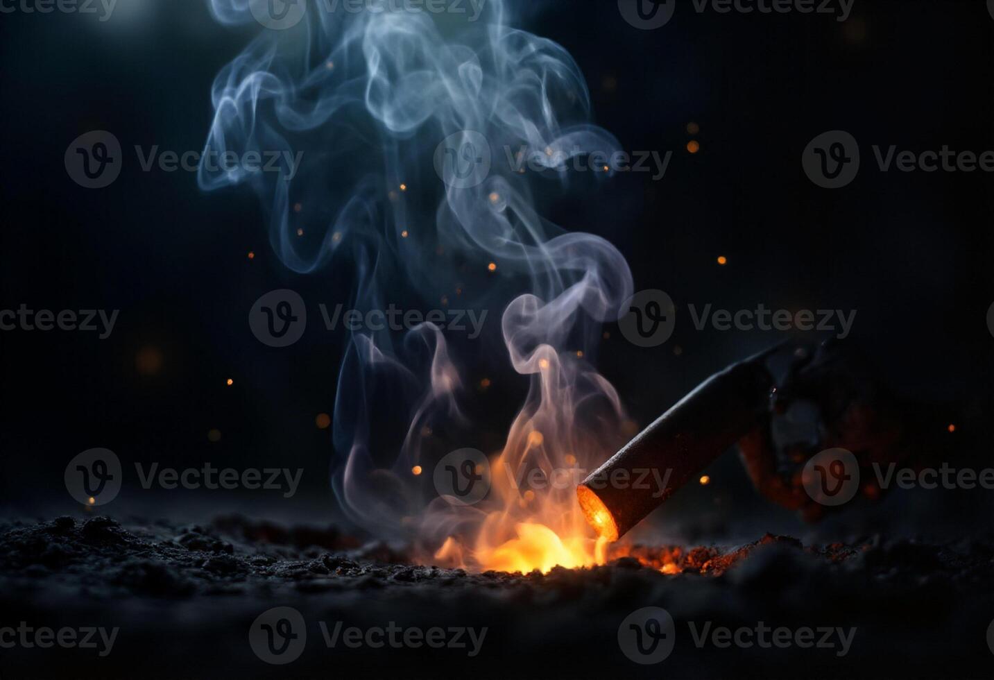 A burning torch is being lit by a fire photo