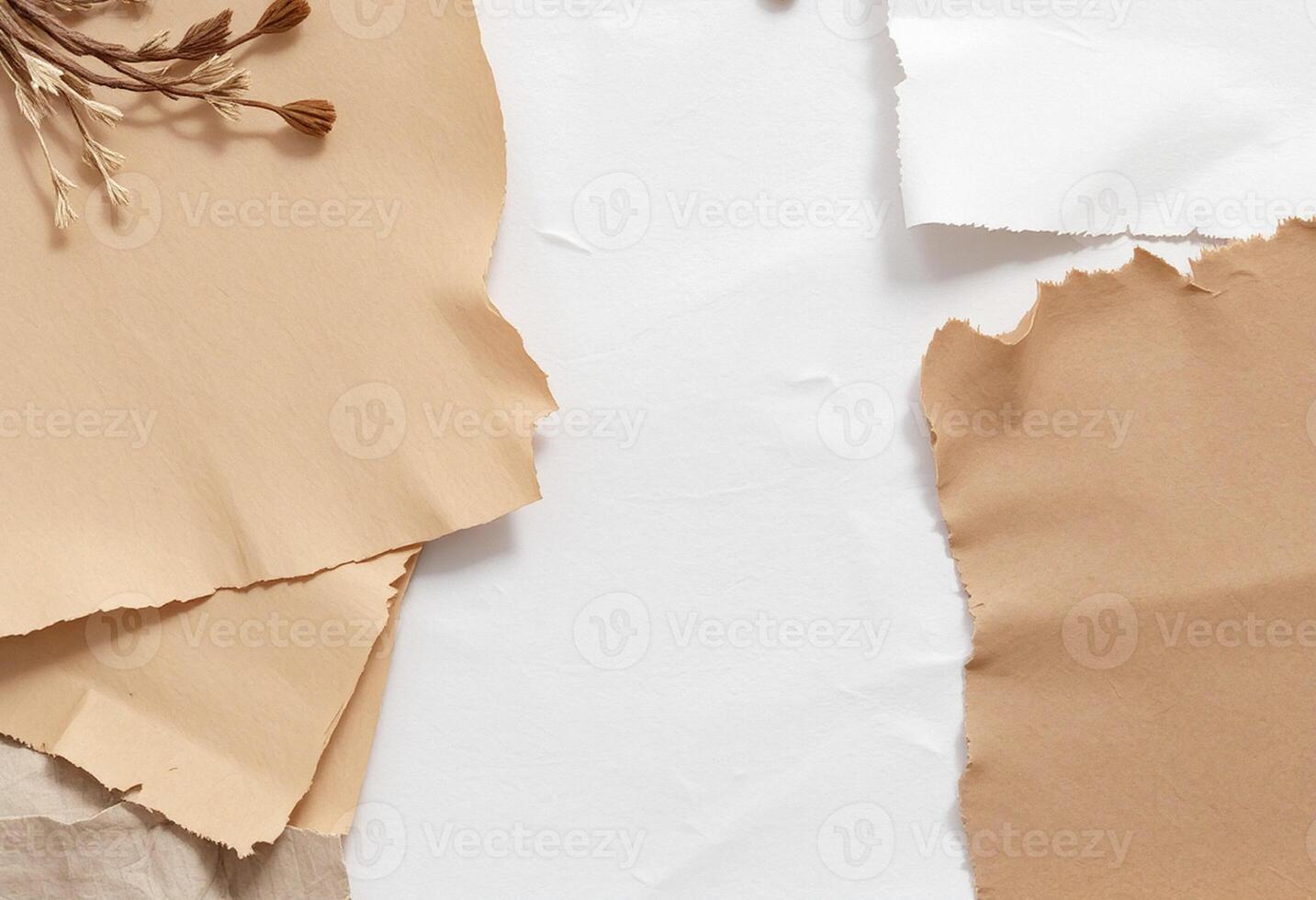 Several pieces of paper with dried flowers on top photo