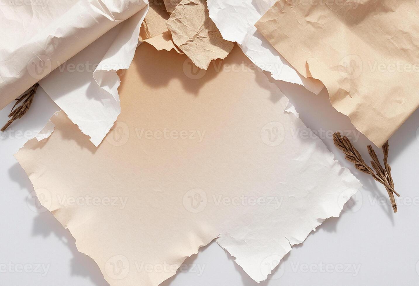 Several pieces of paper with brown crumpled edges photo