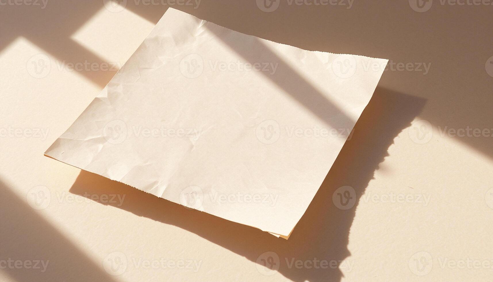A piece of paper on a table with sunlight photo