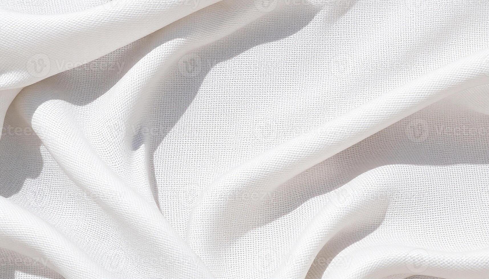 A white fabric with folds and folds photo
