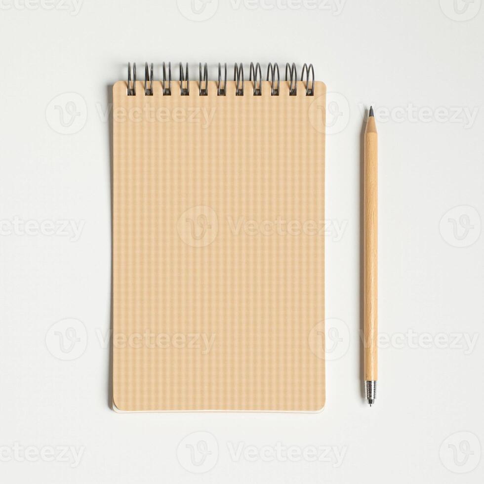 A notepad and pen on a white surface photo