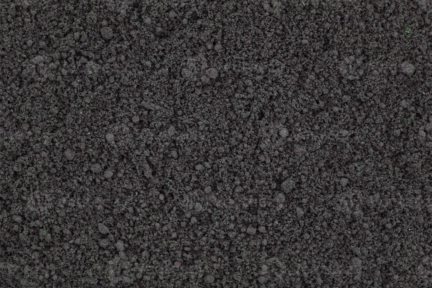 loosened soil as background. brown ground surface photo