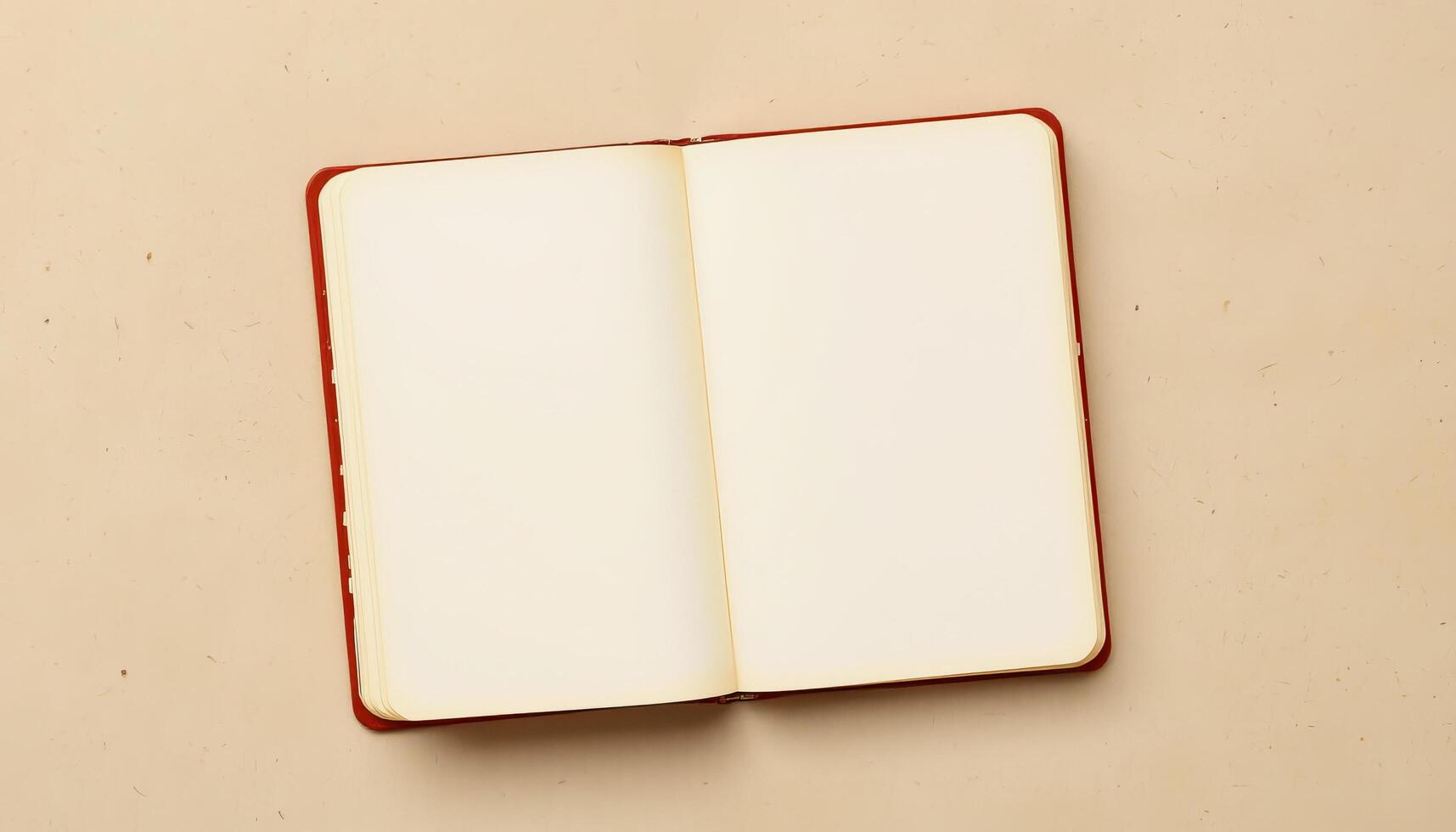 Open blank notebook on beige surface with soft lighting creating calm and inviting atmosphere photo