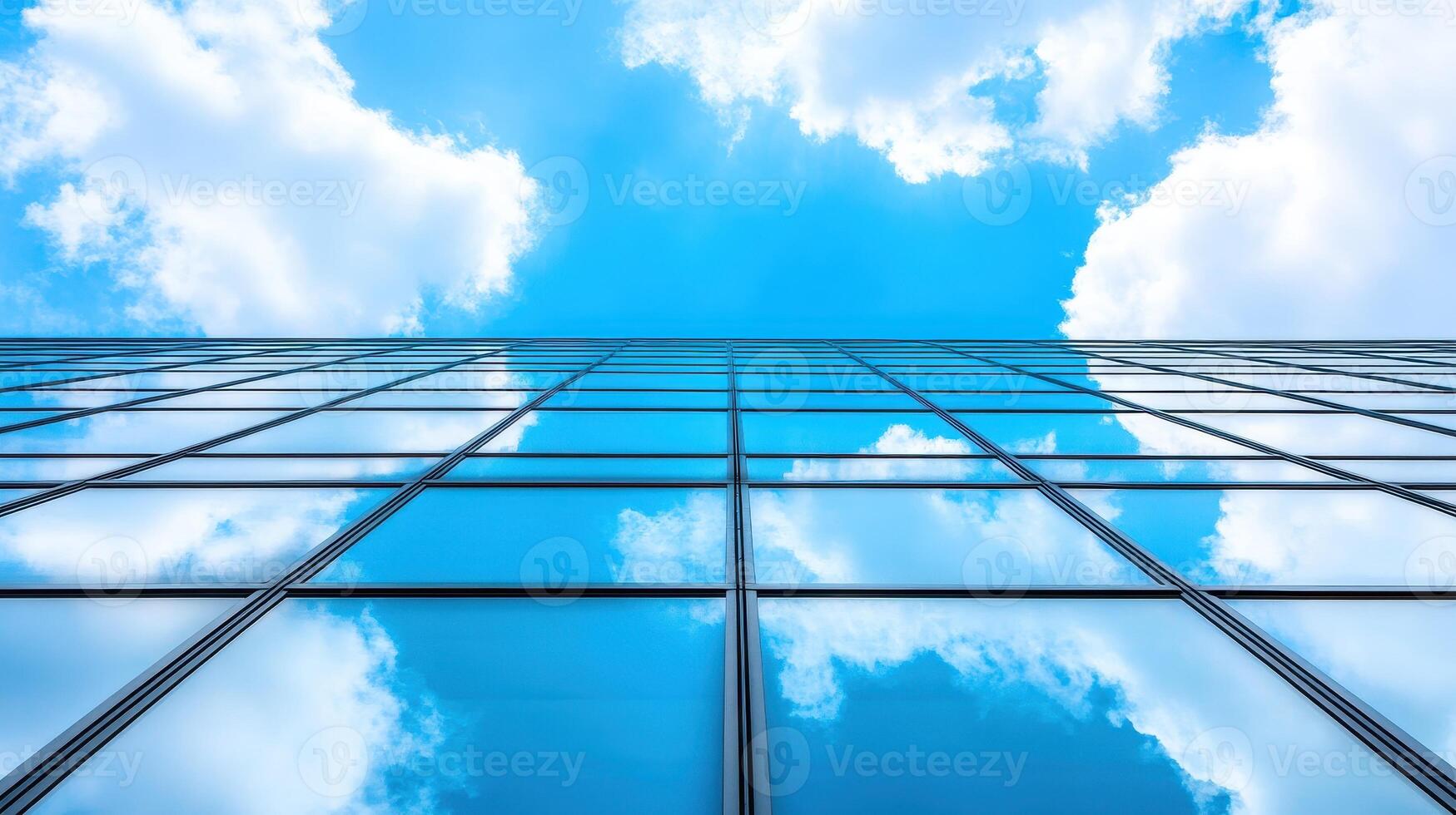 Skyward Reflection Clouds and Azure Mirrored on a Modern Building Facade Perspective View photo