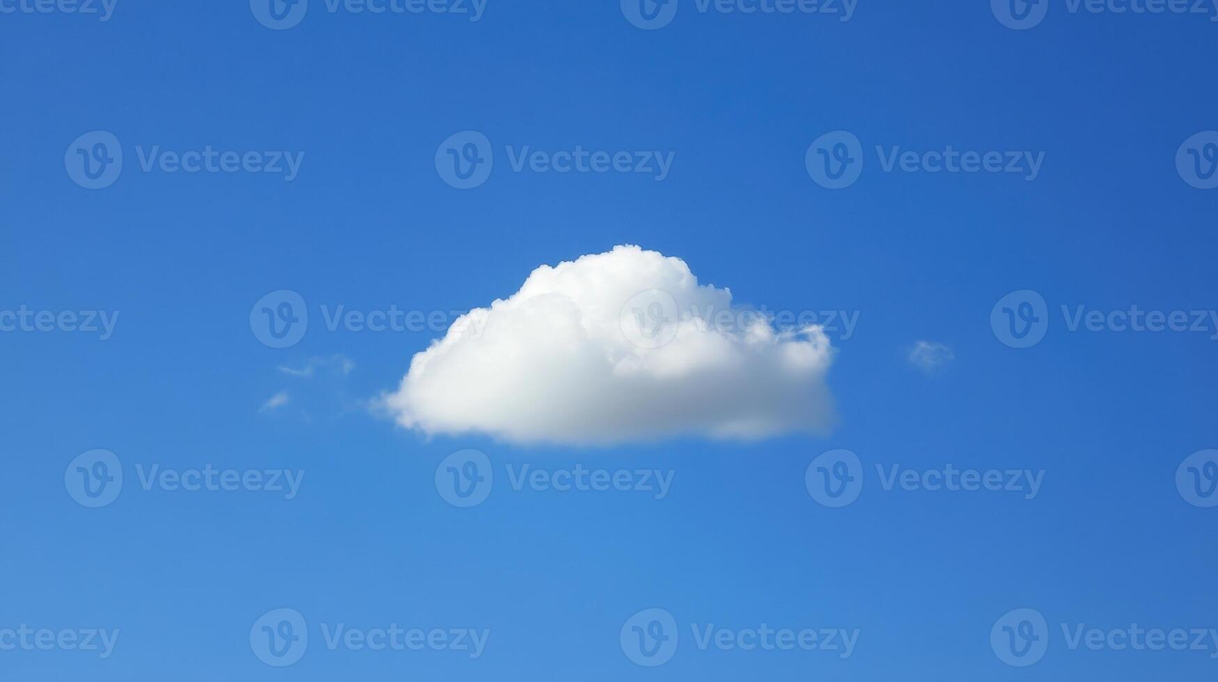 A Single Cloud Drifting in the Azure Sky Simplicity Purity Untroubled Serenity Under the Open Skies photo