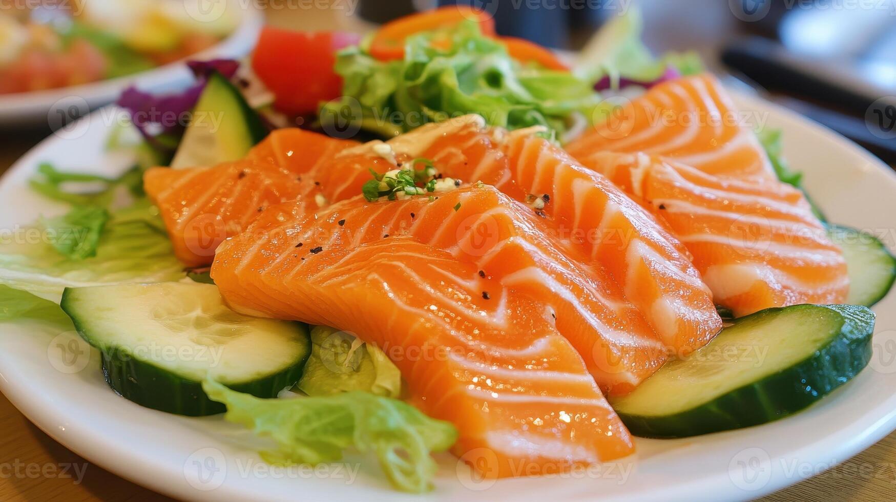 Fresh Salmon Sashimi Salad A Vibrant Delight with Greens Cucumber and Tomato Accents photo