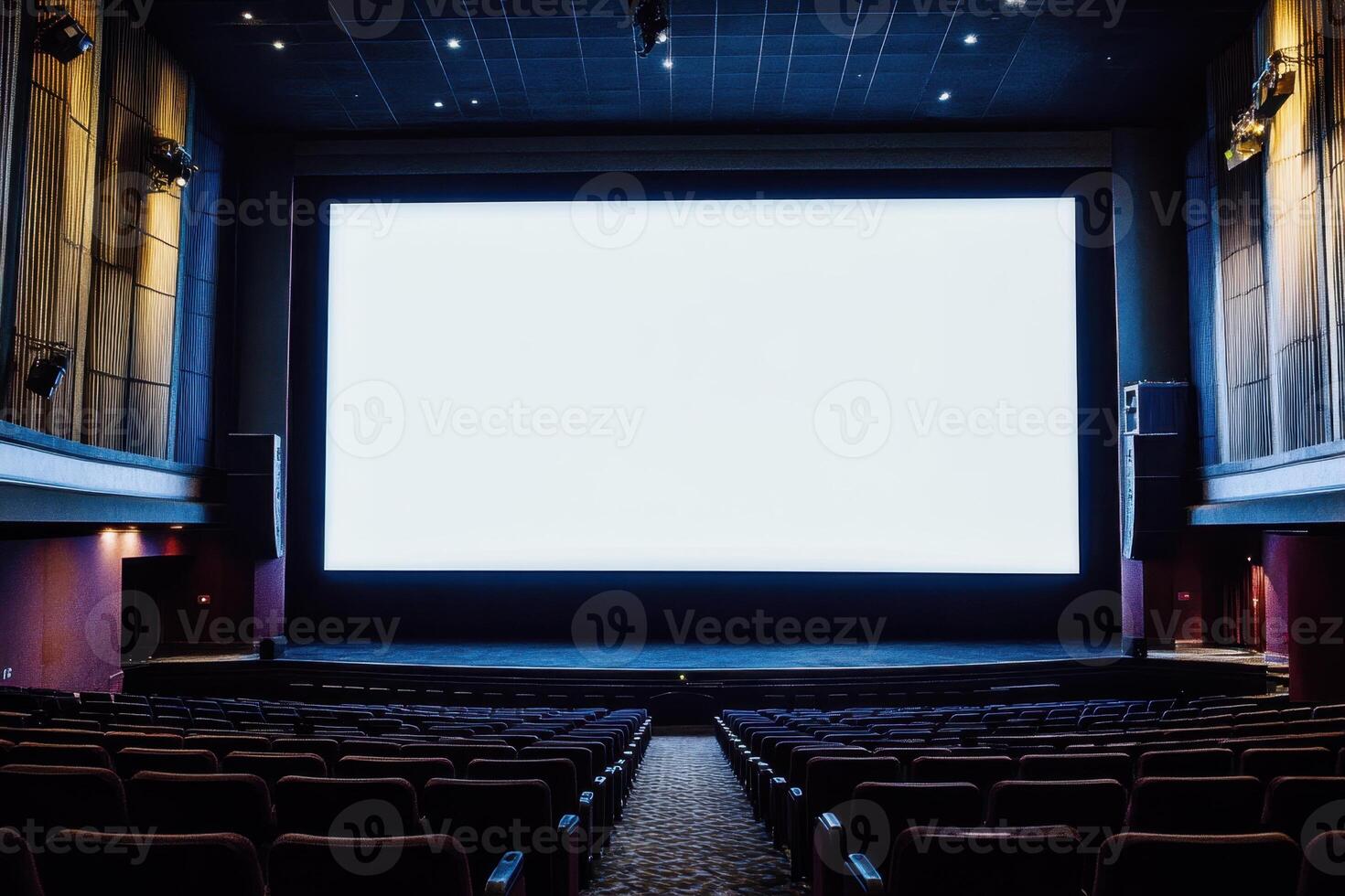 an empty theater with a large screen photo