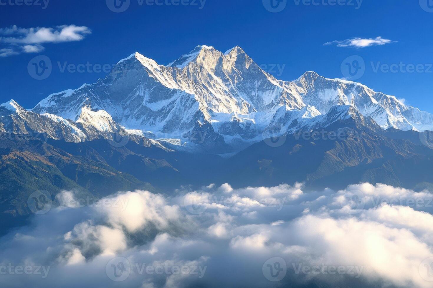 a mountain range is seen in the clouds photo