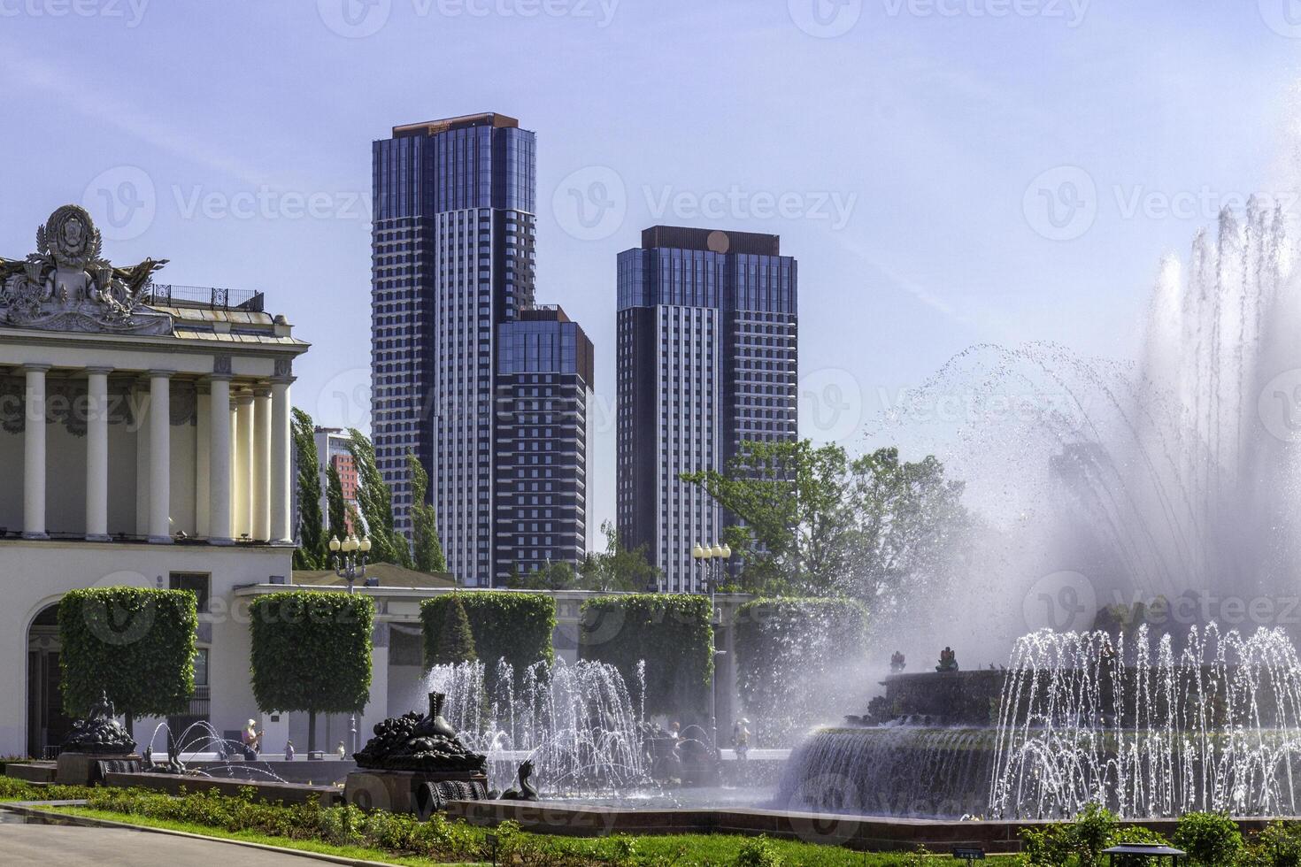 Fountain and modern skyscrapers in VDNKh park in Moscow. photo
