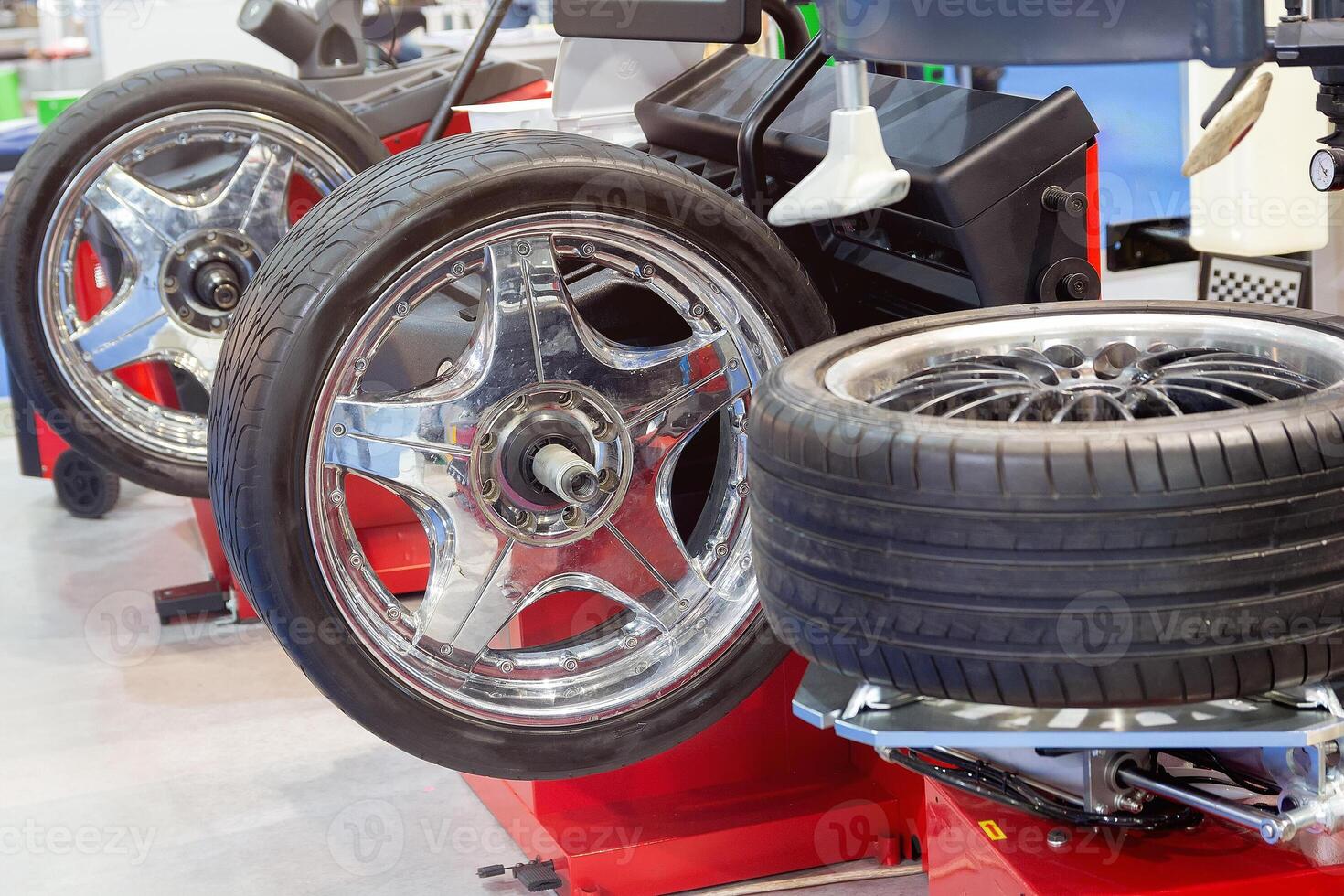 Tire fitting of automobile wheels on modern equipment in a car service photo