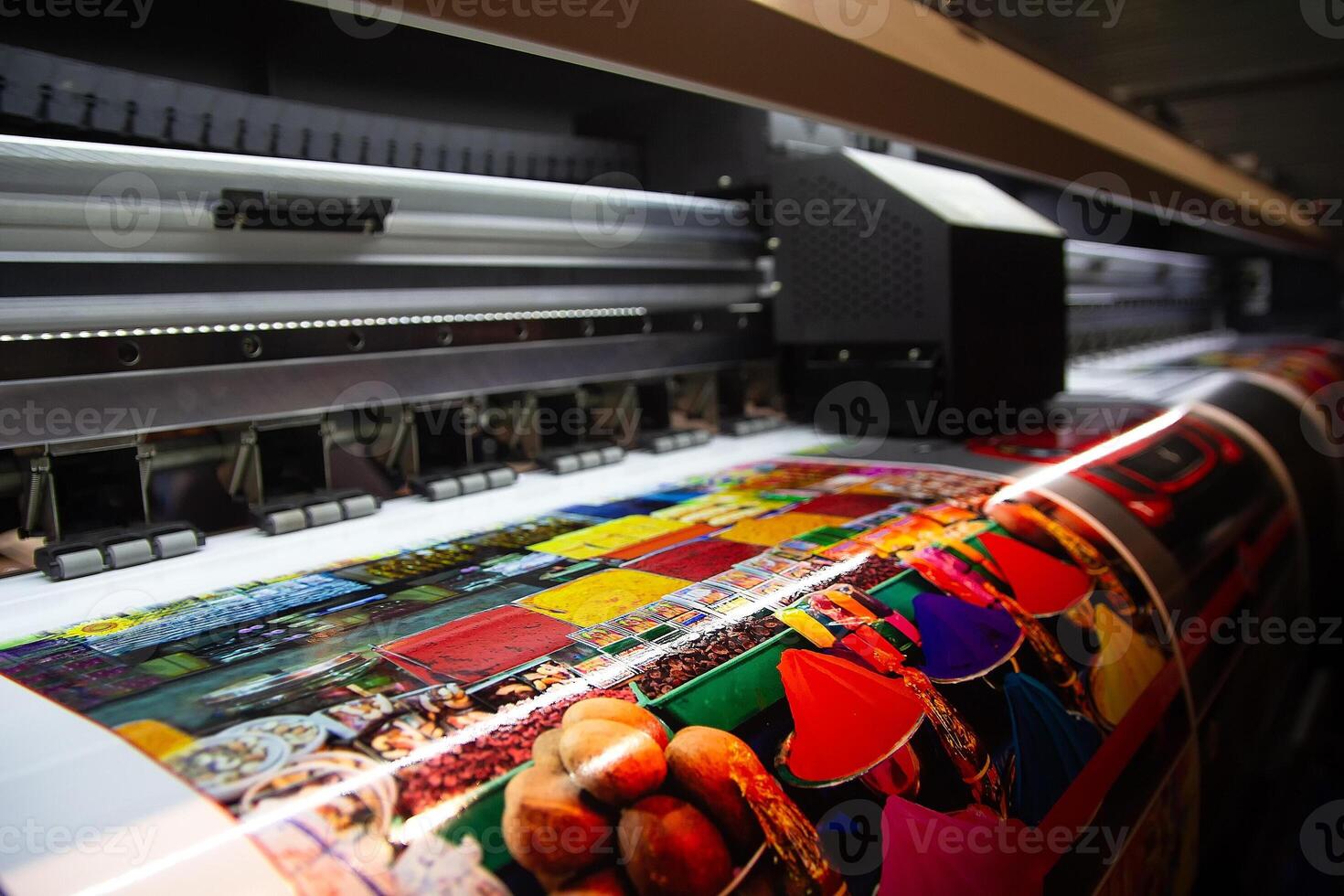 Large format printing machine in operation close-up. Industry photo