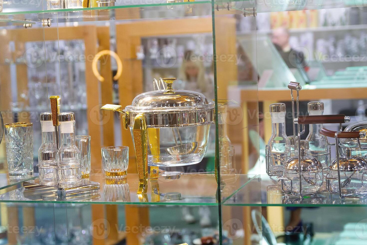 Elegant glass dishes on a window in a store photo
