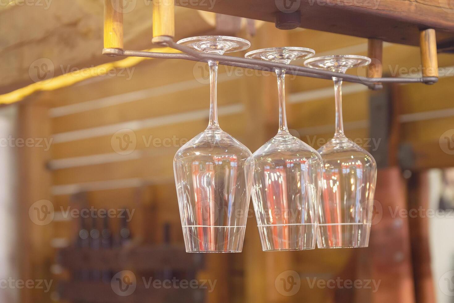 Glasses on a shelf in a bar photo