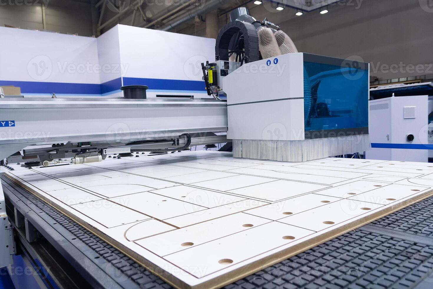 Modern machine for cutting chipboard at a furniture factory. Indusrty photo