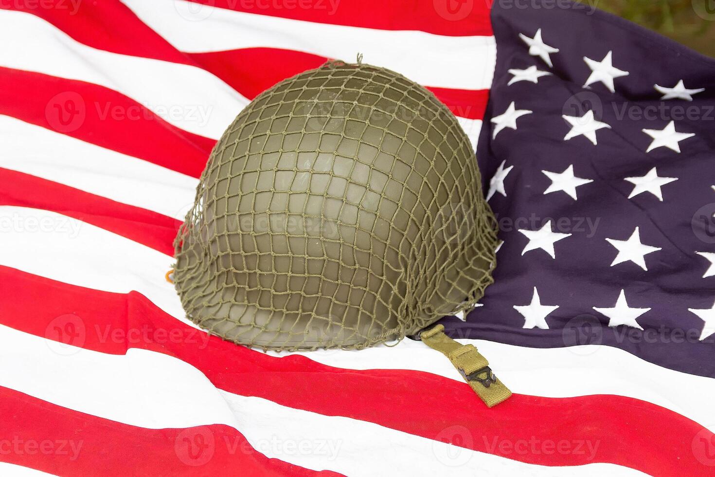 Soldier's helmet and the times of the Second World War and the US flag. Patriotism photo