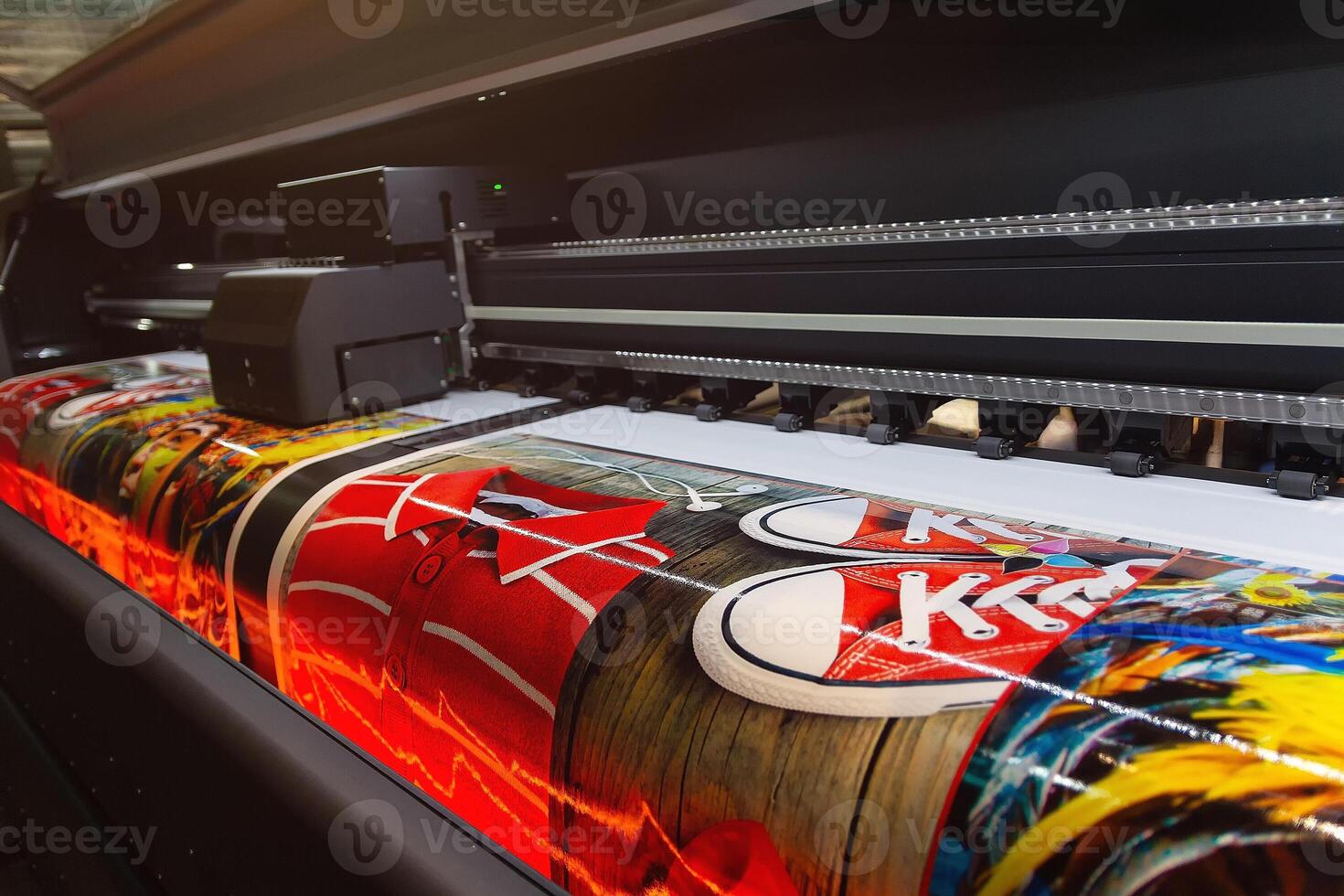 Large format printing machine in operation close-up. Media photo