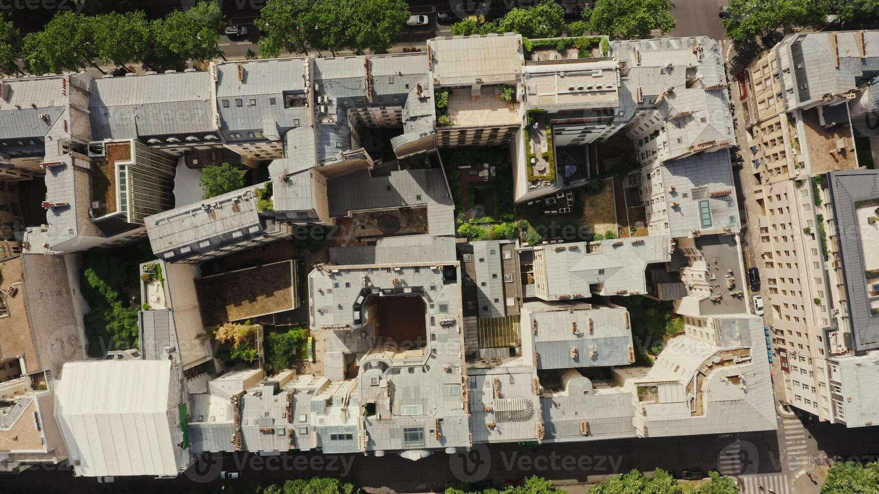 Closed courtyards of residential buildings in the center of Paris. Top view of the roofs of traditional houses in the historic city center. France, Paris, drone photo
