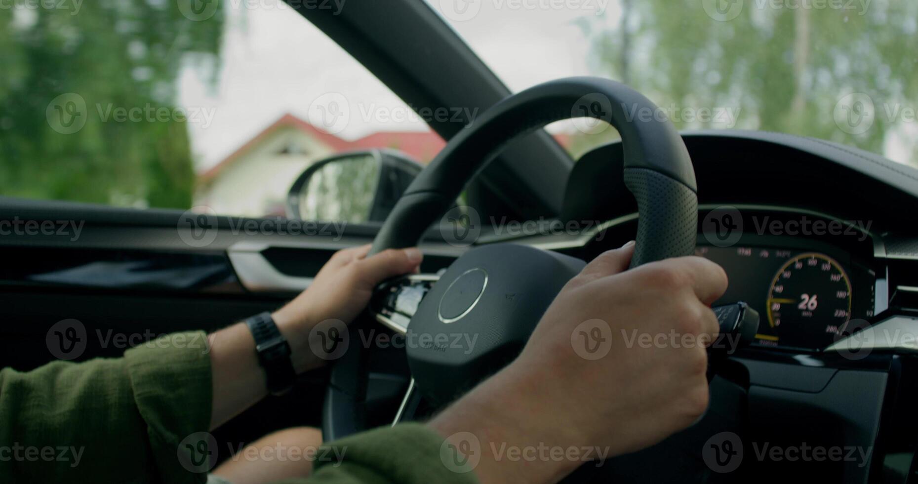 A man drives a car. Close-up of his hands, an unrecognizable person. View from the car interior. photo