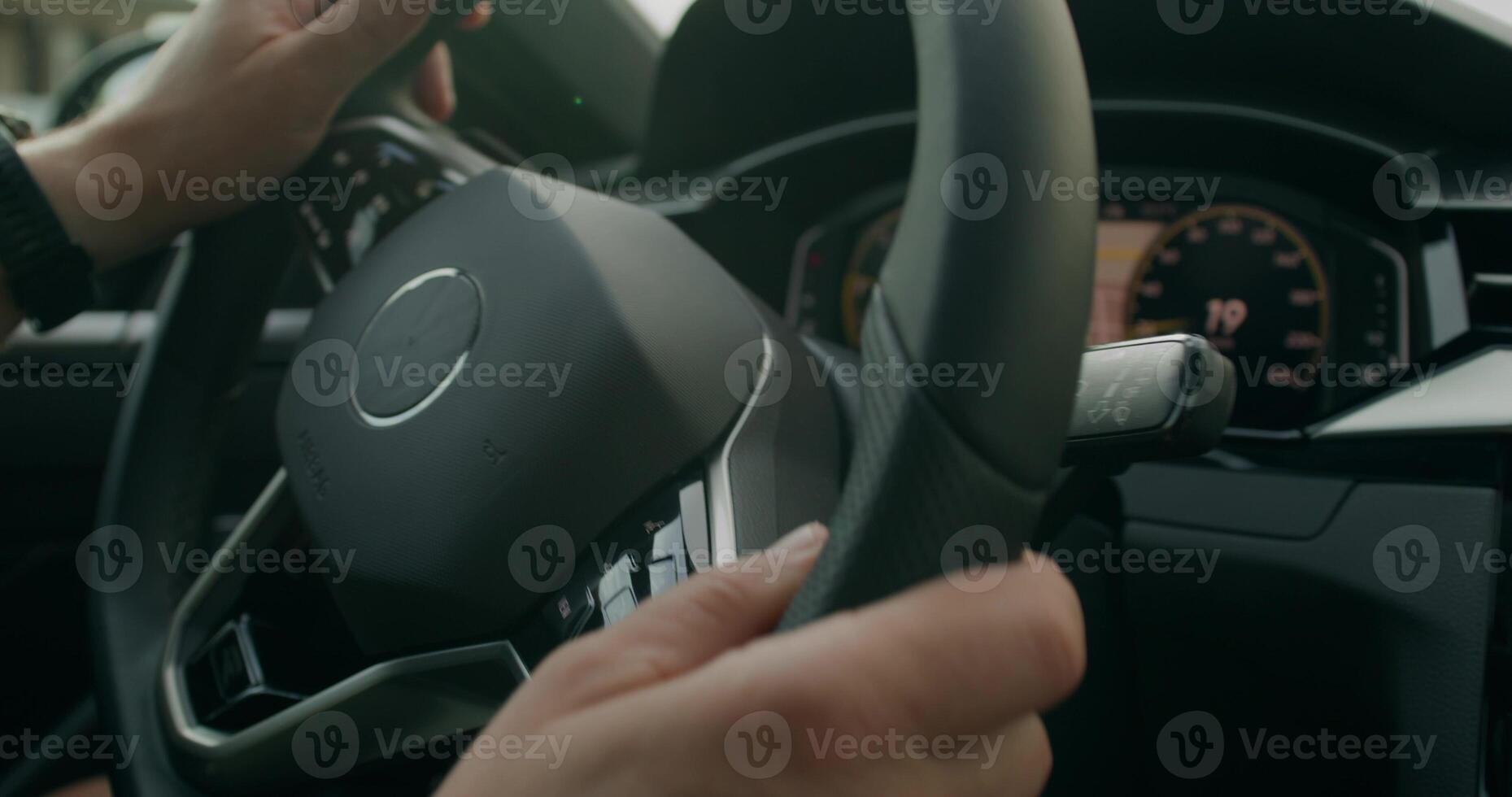 A man drives a car. Close-up of his hands, an unrecognizable person. View from the car interior. Summer photo