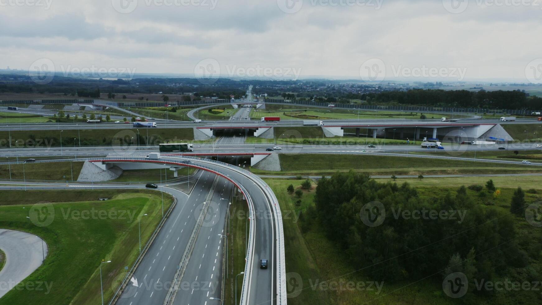 filming from a drone, a view of the road junction with cars moving along it. Aerial view, from quadrocopter - moving photo