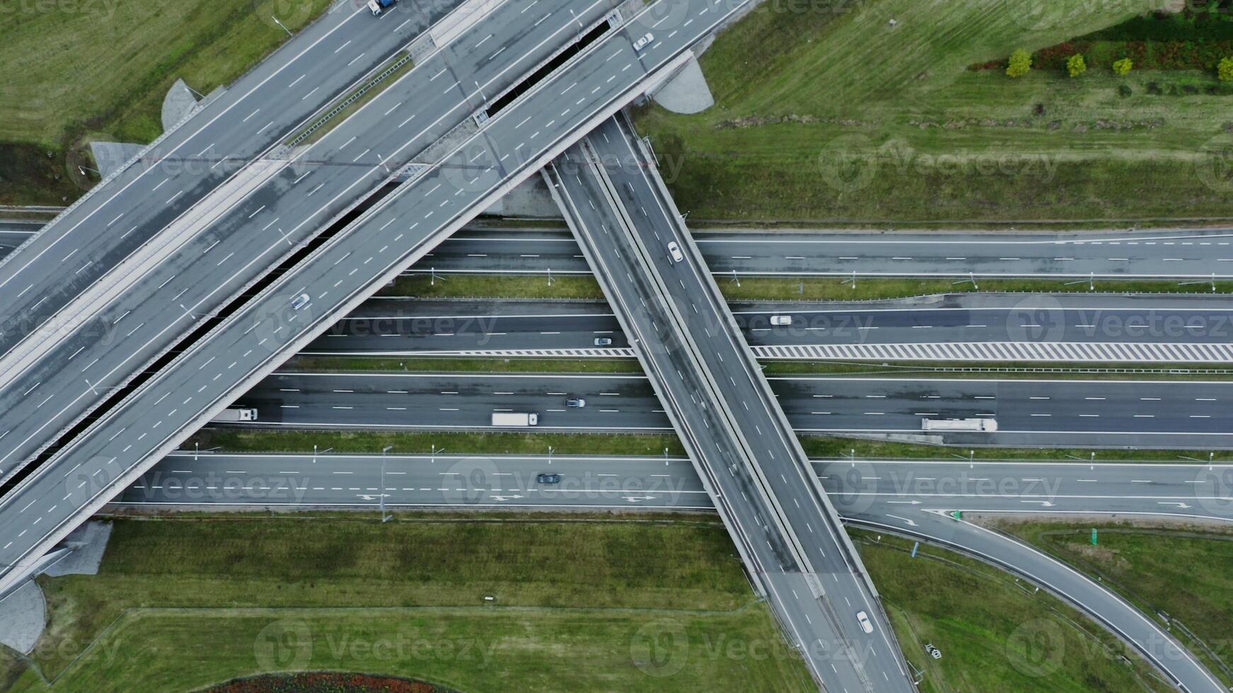 Multilevel road, top view, filming from a quadrocopter. View of the road junction with cars passing along it, shooting from a drone - shooting photo