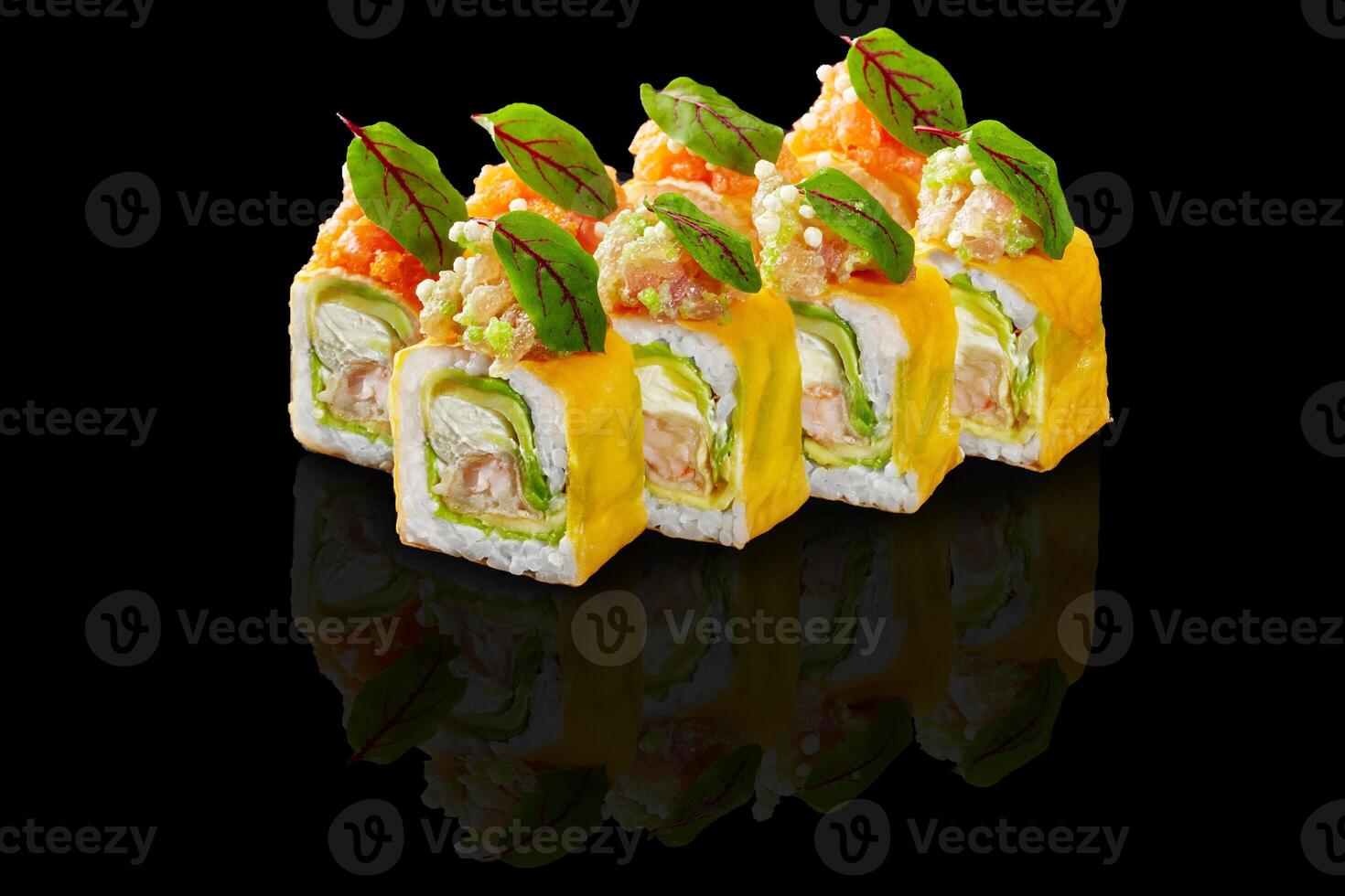 Five colorful uramaki sushi rolls are reflecting on a black background photo