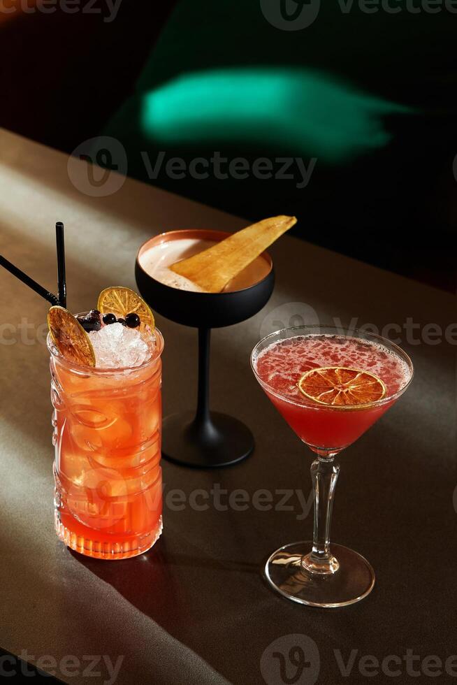Bartender preparing exotic cocktails with tiki style and modern touches photo