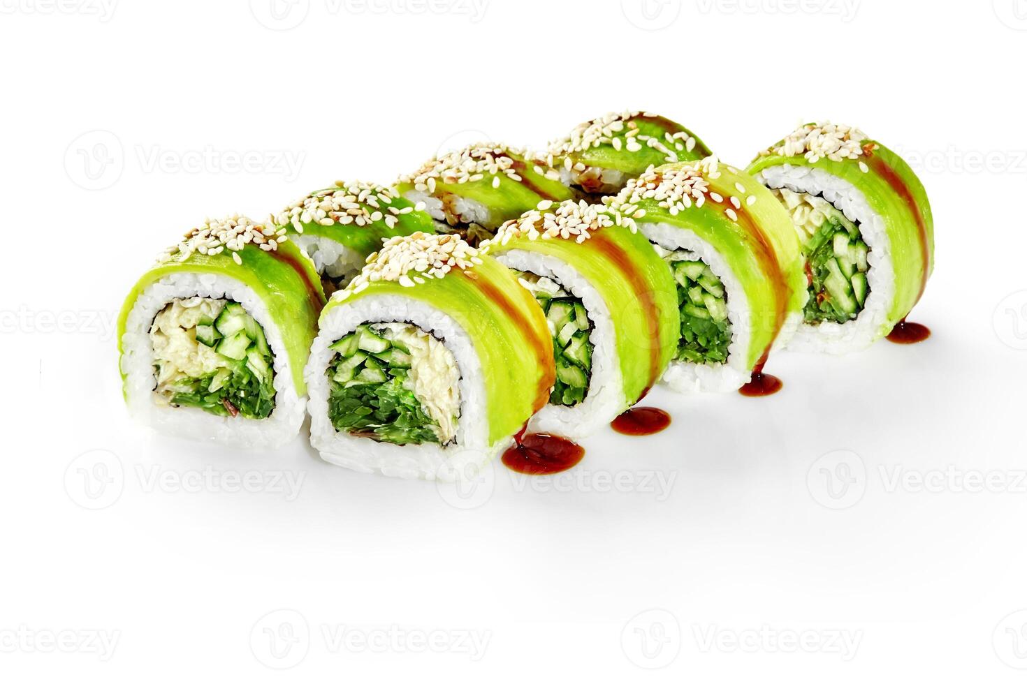 Green dragon sushi rolls with avocado, cucumber, sesame seeds and unagi sauce drizzled on white background photo