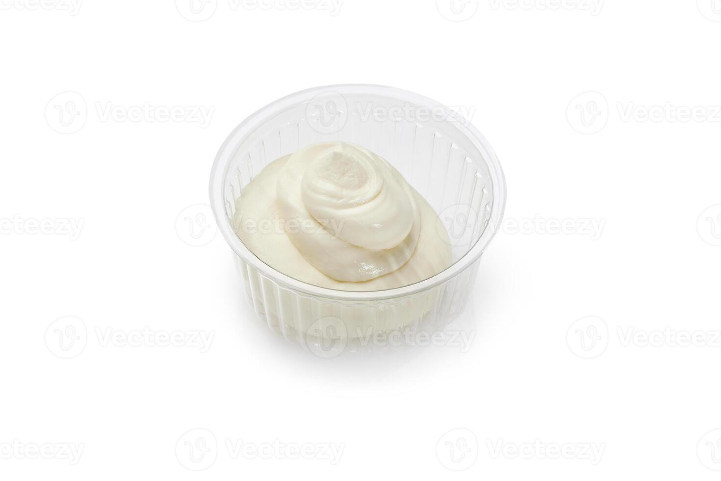 Plastic container with tasty mayonnaise sauce isolated on white background photo