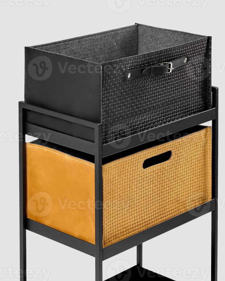 Modern shelving unit displaying stylish storage baskets with leather and woven details photo