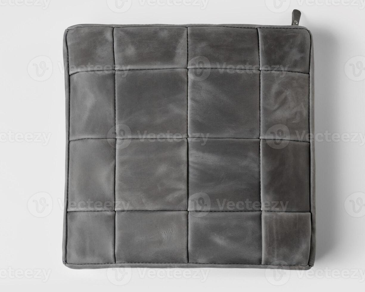 Gray leather case with zipper closure presenting a quilted pattern photo