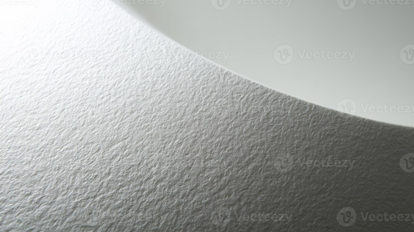 Ceramic white surface displaying a textured pattern and subtle imperfections up close photo