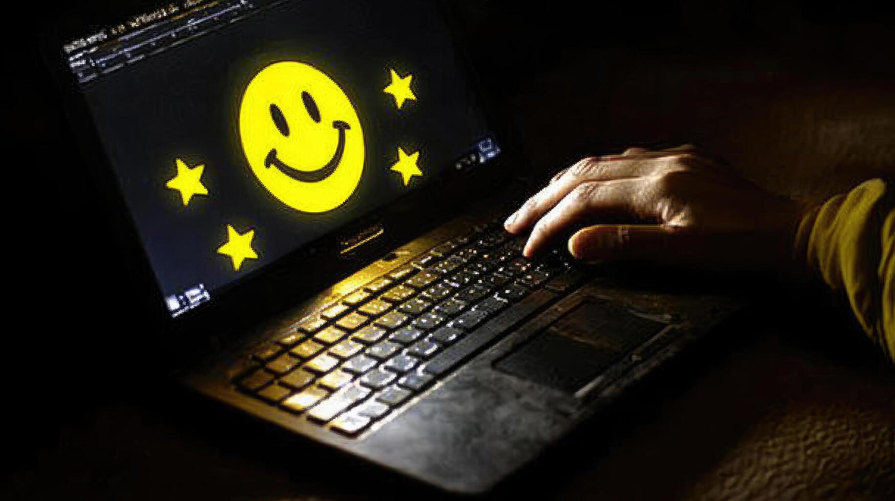 Optimistic Evening Workflow CloseUp of Laptop Displaying Smile Surrounded by Stars While Typing in the Dark photo