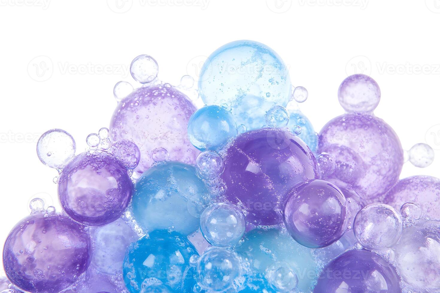 A cluster of vibrant purple and blue translucent spheres clings together on white space photo