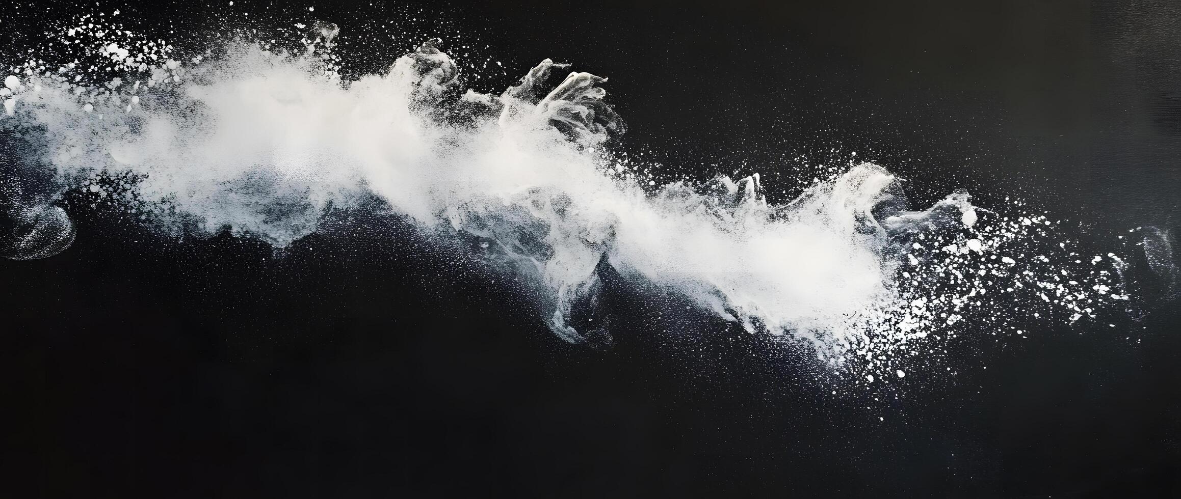 A dynamic plume of white powder appears to explode across a dark canvas photo