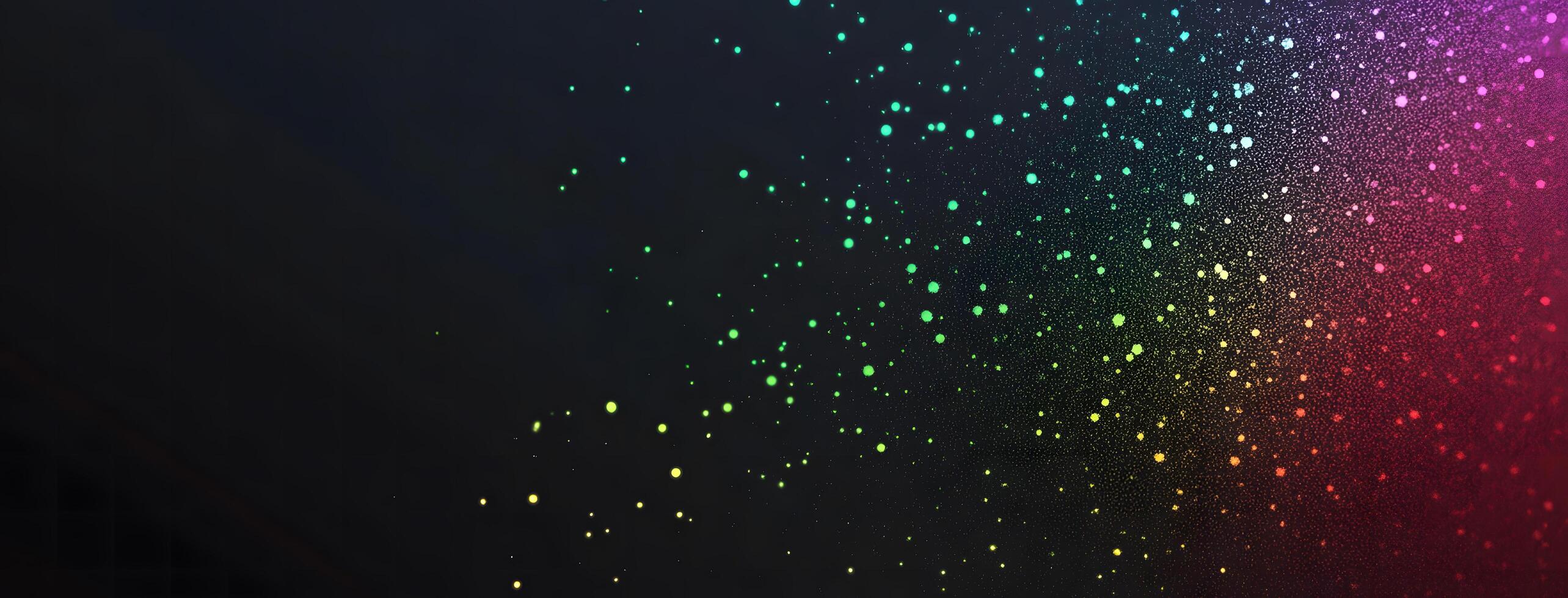 A spectrum of vibrant, multicolored particles glows vividly against a dark, gradient background photo