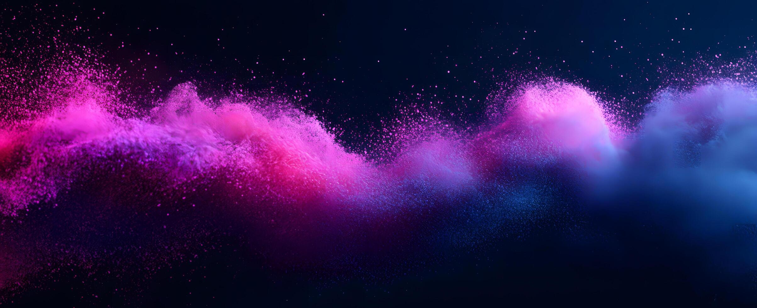 A vibrant surge of pink and blue powder bursts vividly on a dark background photo