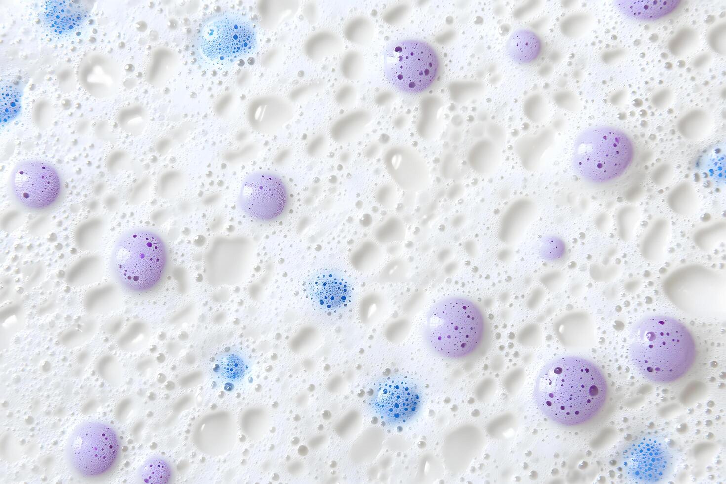 Bubbly surface exhibits a delightful array of textures with both blue and lilac colored blobs photo