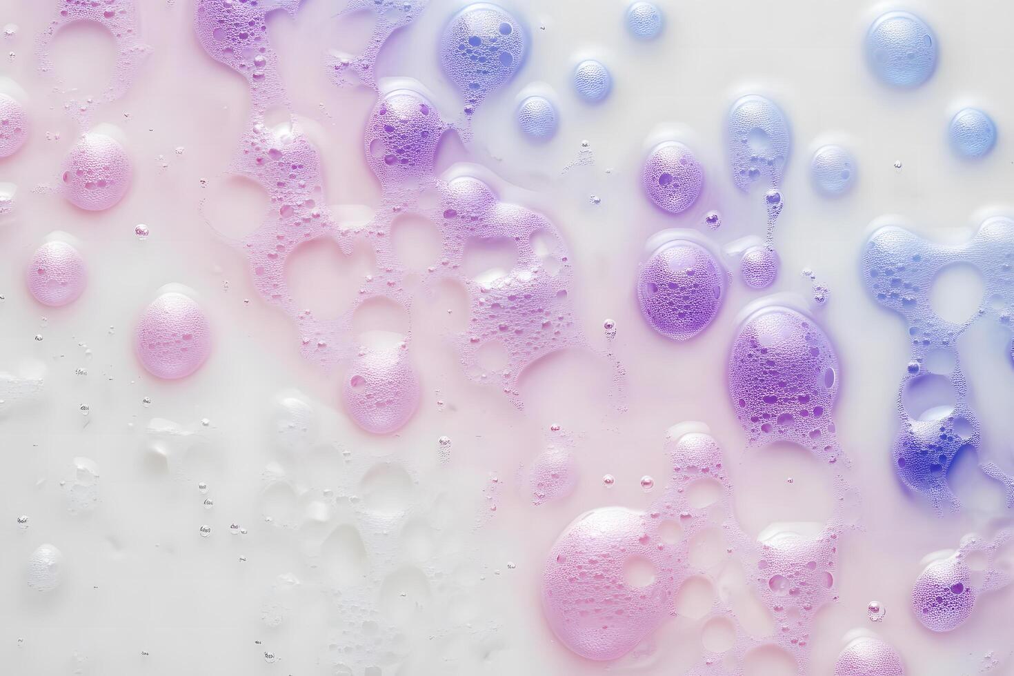 Closeup shows pastel bubbles floating in a milklike liquid with gradient coloring photo