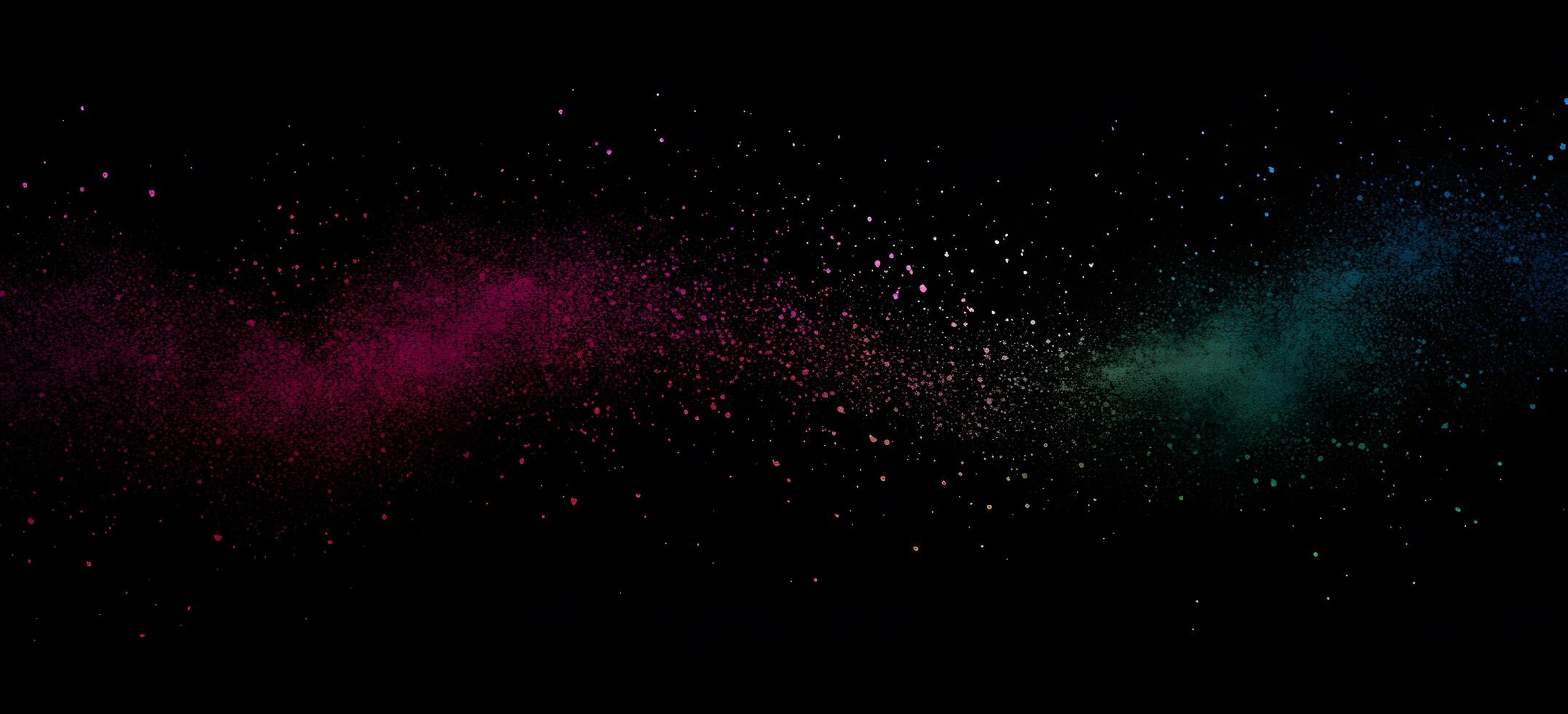 Colorful paint dust creates a vibrant splash effect against an isolated black backdrop photo