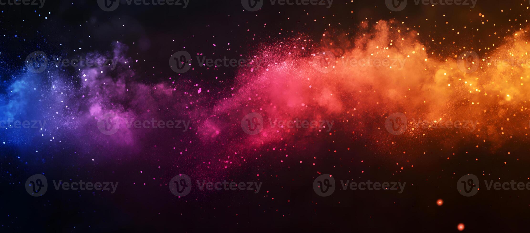 Colorful powder explosions create vibrant, eyecatching cloud of particles against a dark background photo