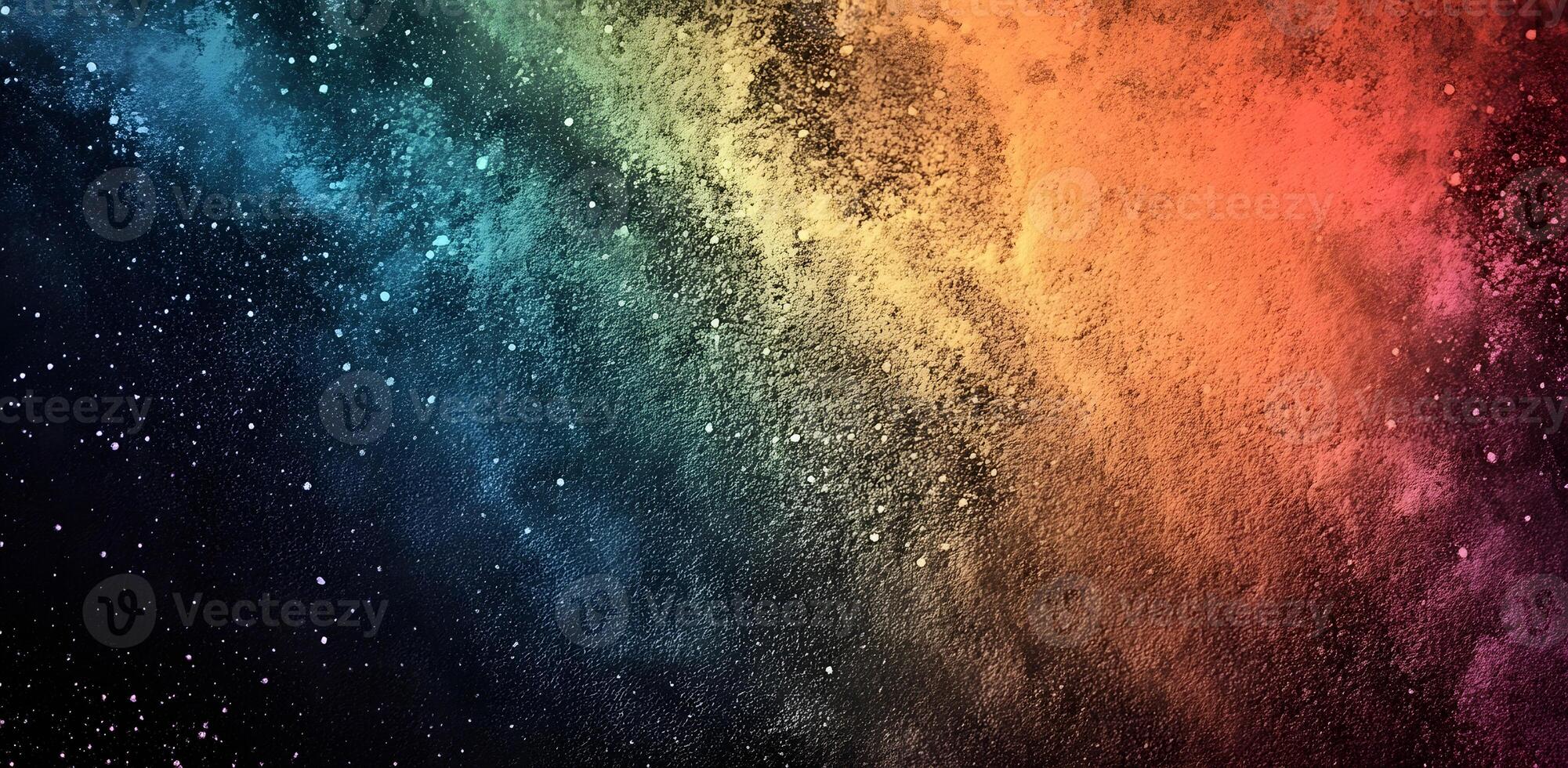 Colorful powder explosion splits a black space with scattered particles and grainy texture photo