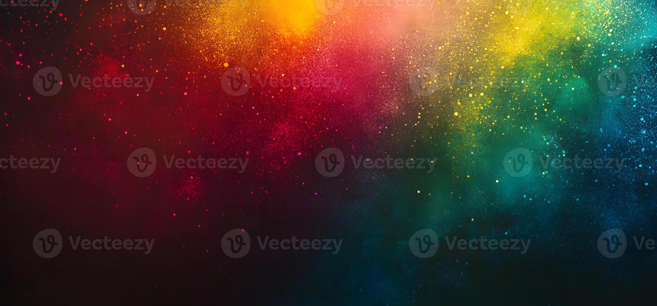 Colorful splatters of red, yellow, green, and blue paint across a dark background create an abstract scene photo